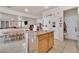 Bright kitchen features a granite island, tile flooring and stainless-steel appliances at 10105 Shore Pine Ave, Las Vegas, NV 89129