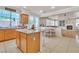 Spacious open kitchen featuring an island, ample counter space, and a dining area for casual meals at 10105 Shore Pine Ave, Las Vegas, NV 89129