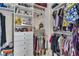 Organized walk-in closet featuring shelving and hanging storage at 10105 Shore Pine Ave, Las Vegas, NV 89129
