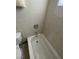 Close-up of a tub-shower combo in a bathroom with tile walls at 2516 E Mesquite Ave, Las Vegas, NV 89101