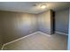 This bedroom features neutral walls, tile floors, and a small closet at 2516 E Mesquite Ave, Las Vegas, NV 89101