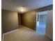 This bedroom features neutral walls, tile floors, and a door to another room at 2516 E Mesquite Ave, Las Vegas, NV 89101