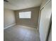Bedroom featuring a window and closet, and tile flooring at 2516 E Mesquite Ave, Las Vegas, NV 89101