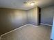 This bedroom features neutral walls, tile floors, and a small closet at 2516 E Mesquite Ave, Las Vegas, NV 89101