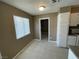 Cozy dining area with a large window to the left and access to the kitchen at 2516 E Mesquite Ave, Las Vegas, NV 89101