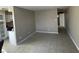 Spacious living room with tile flooring, open layout, and access to the kitchen at 2516 E Mesquite Ave, Las Vegas, NV 89101