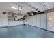 This garage is equipped with ample storage, cabinets, and overhead shelving, enhancing its functionality at 6540 W Cougar Ave, Las Vegas, NV 89139