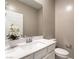 Bright powder bathroom featuring white cabinets, a modern sink, and neutral wall color at 1438 Dire Wolf Ave, North Las Vegas, NV 89084