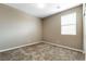 Cozy carpeted bedroom featuring a bright window, perfect for relaxation and rest at 1438 Dire Wolf Ave, North Las Vegas, NV 89084