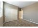 Comfortable carpeted bedroom featuring a spacious closet and plenty of natural light at 1438 Dire Wolf Ave, North Las Vegas, NV 89084