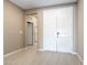 Inviting entryway with double doors and tile flooring, seamlessly blending style and functionality at 1438 Dire Wolf Ave, North Las Vegas, NV 89084