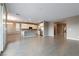 Spacious kitchen with an island featuring stainless steel appliances, tile backsplash, and ample counter space at 1438 Dire Wolf Ave, North Las Vegas, NV 89084