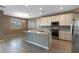 Eat-in kitchen featuring stainless steel appliances, granite countertops, and light-filled windows overlooking the backyard at 1438 Dire Wolf Ave, North Las Vegas, NV 89084