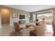 Bright living room features neutral tones, modern furniture and large sliding glass doors leading to the backyard at 1438 Dire Wolf Ave, North Las Vegas, NV 89084