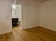 Bedroom showcasing access to an ensuite bathroom with wood flooring at 310 Brookside Ln # B, Las Vegas, NV 89107