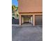 Exterior view of garage with one bay closed and one open at 310 Brookside Ln # B, Las Vegas, NV 89107