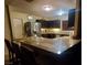 Modern kitchen featuring a breakfast bar and ample cabinet space at 4369 Greenhill Dr, Las Vegas, NV 89121