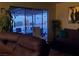 Living room with sliding glass doors leading to a pool at 4369 Greenhill Dr, Las Vegas, NV 89121