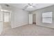 Well-lit bedroom with ceiling fan, closet, and neutral decor at 8250 N Grand Canyon Dr # 2059, Las Vegas, NV 89166