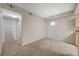 Carpeted hallway with doors leading to bedrooms and bathroom at 8250 N Grand Canyon Dr # 2059, Las Vegas, NV 89166