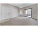 Spacious living room with carpet and door at 8250 N Grand Canyon Dr # 2059, Las Vegas, NV 89166