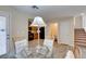 Glass dining table with chairs in open concept area at 4750 Newby Hall Ct, Las Vegas, NV 89130