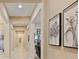 Bright hallway with tile floors and framed artwork at 6423 Fosco Ct, Las Vegas, NV 89131