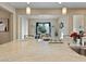 Granite countertop kitchen island with breakfast bar seating and view of dining area at 6423 Fosco Ct, Las Vegas, NV 89131