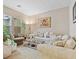 Comfortable living room with sectional sofa and large windows at 6423 Fosco Ct, Las Vegas, NV 89131