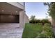 Landscaped backyard with artificial turf and covered patio at 1228 Stellar Rim Ct, Henderson, NV 89012