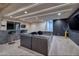 Finished basement with sectional sofa, wet bar, and large TV at 1228 Stellar Rim Ct, Henderson, NV 89012