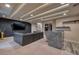 Spacious basement recreation room with a wet bar and large screen TV at 1228 Stellar Rim Ct, Henderson, NV 89012