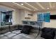 Finished basement recreation room featuring wet bar and comfortable seating at 1228 Stellar Rim Ct, Henderson, NV 89012