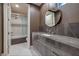 Elegant bathroom with a large vanity, marble countertop, and a soaking tub at 1228 Stellar Rim Ct, Henderson, NV 89012