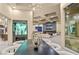 Elegant dining room with a large dark wood table and modern chandelier at 1228 Stellar Rim Ct, Henderson, NV 89012