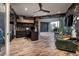 Stylish home office with built-in desk, access to backyard, and green sofa at 1228 Stellar Rim Ct, Henderson, NV 89012