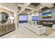 Living room features a stone fireplace, city views, and modern decor at 1228 Stellar Rim Ct, Henderson, NV 89012