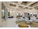 Open living area boasts expansive windows, high ceilings, and a modern sectional sofa at 1228 Stellar Rim Ct, Henderson, NV 89012