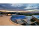 Expansive infinity pool and spa with fire pit and stunning panoramic views at 1228 Stellar Rim Ct, Henderson, NV 89012