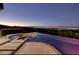 Infinity pool with a fire pit and stunning city views at 1228 Stellar Rim Ct, Henderson, NV 89012