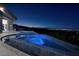 Modern infinity pool and spa at night, showcasing a breathtaking view of the cityscape at 1228 Stellar Rim Ct, Henderson, NV 89012