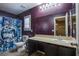 Bathroom with single vanity and Nightmare Before Christmas themed shower curtain at 10633 Mount Blackburn Ave, Las Vegas, NV 89166