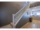 Staircase with white railing and gray walls at 10633 Mount Blackburn Ave, Las Vegas, NV 89166