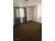 Bedroom featuring neutral carpet, a window with curtain and an electrical outlet at 2509 Canosa Ave, Las Vegas, NV 89104