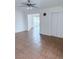 Open living room with tile flooring, ceiling fan, and sliding doors to the outside at 2509 Canosa Ave, Las Vegas, NV 89104