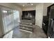 Kitchen with an island, dark cabinets, and granite countertops at 8505 Bellery Ave, Las Vegas, NV 89143