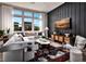 Living room showcasing a stylish sectional sofa and a dark accent wall at 667 Agate Bridge St, Las Vegas, NV 89138