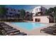Community pool with plenty of lounge chairs for relaxation at 667 Agate Bridge St, Las Vegas, NV 89138