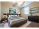 Comfortable bedroom with a plush rug, a decorative dresser, and serene wall art at 2664 Chinaberry Hill St, Laughlin, NV 89029
