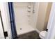 Bathroom featuring an easy-access walk-in shower with built-in shelving at 3125 N Buffalo Dr # 1089, Las Vegas, NV 89128